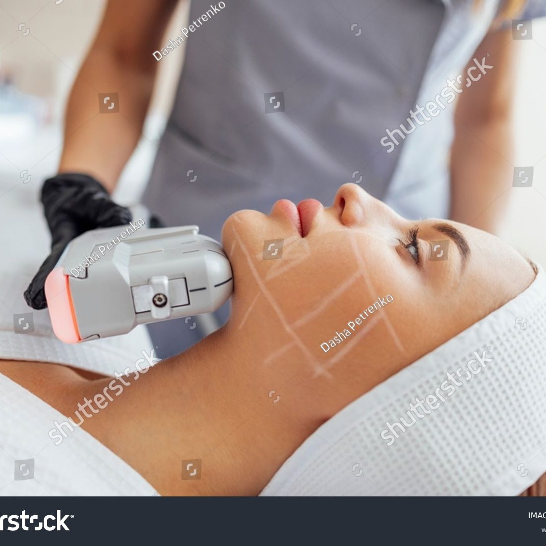 stock-photo-portrait-of-relaxed-young-female-client-getting-smas-ultrasound-face-lifting-massage-with-2303294811